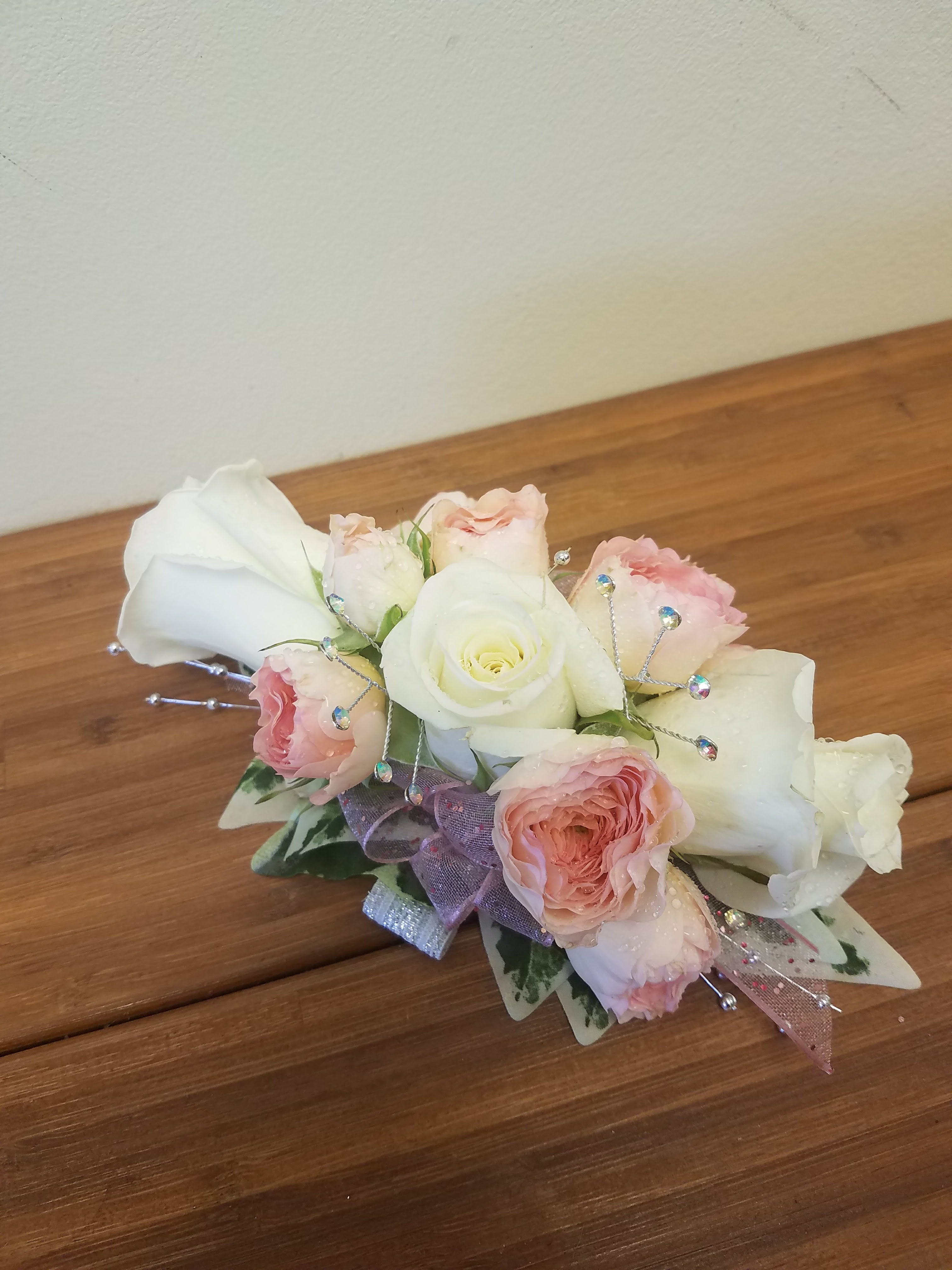 Peachy and white Wrist corsage Peachy and white Wrist corsage - Soft Peach garden spray roses with white roses on a wristlet
