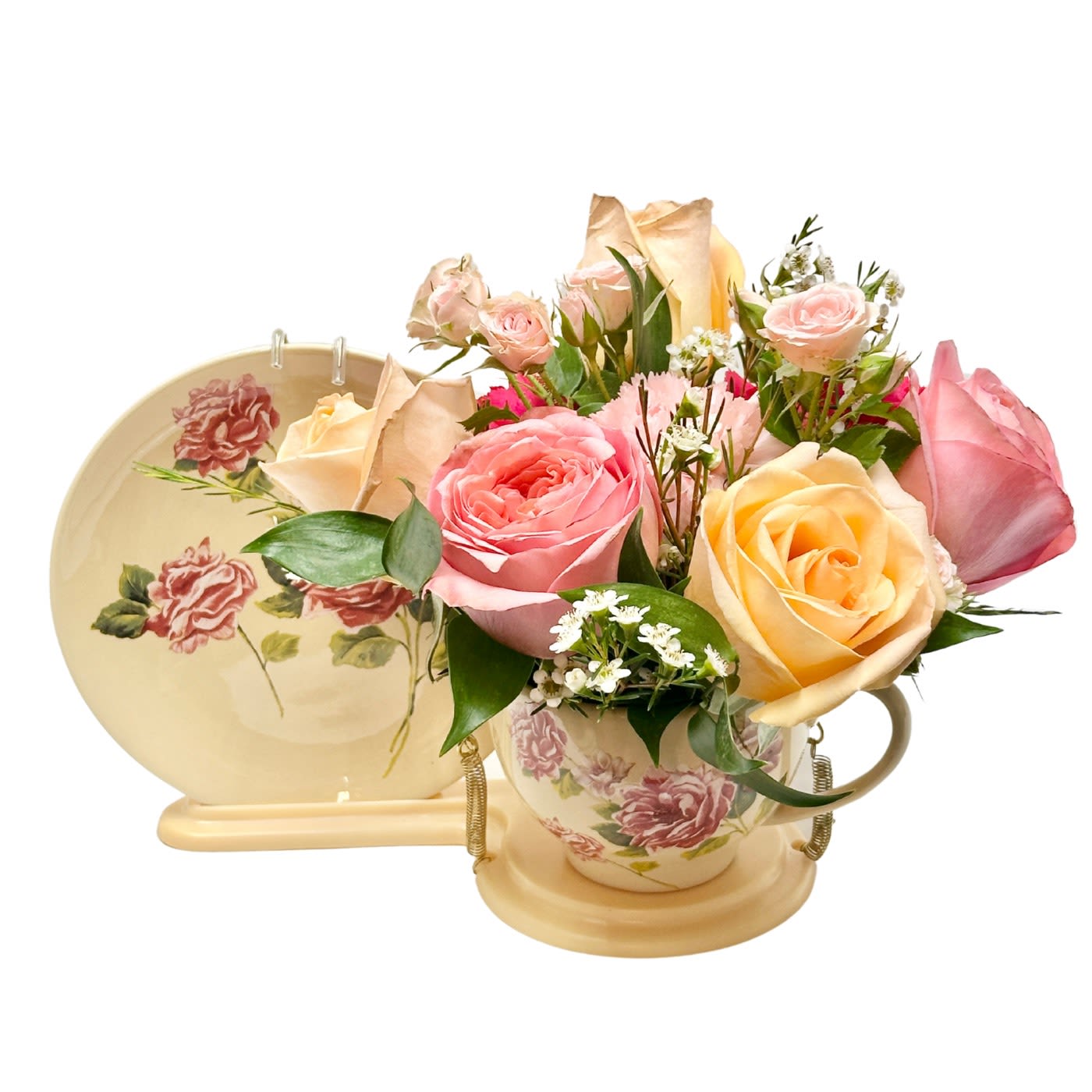 Teacup Bouquet For Mom - Send warm wishes with this lovely gift bouquet that arrives in a ceramic teacup. This charming, old-fashioned bouquet features pink and peach roses.