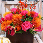 Bright Box Favorite Bright Box Favorite - One of our customer favorites bright seasonal mix of orange dahlia, hot princess roses, gloriosa lilys & mombretia -There may be substitutions in same color scheme based on seasonal availability