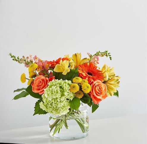 Autumn Sunshine Bouquet - Introducing our Autumn Sunshine Bouquet, a vibrant blend of orange roses, delicate hydrangeas, seasonal fillers, and lush greens. This stunning arrangement captures the warmth and beauty of autumn, making it the perfect gift to brighten someone's day.  