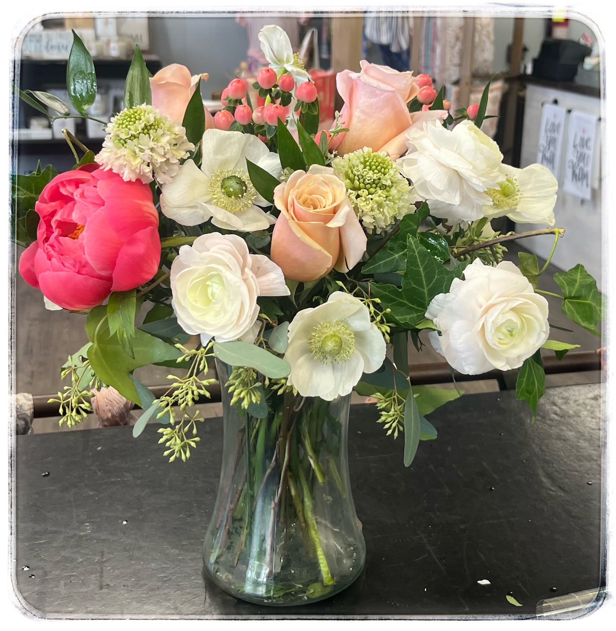Sweet Dreams - This arrangement contains ranunculus. roses, peony, anemone, and hypericum.