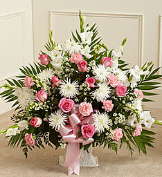 Funeral Basket White & Pink Funeral Basket White & Pink - An elegant funeral basket in assorted fresh flowers in white with accents of pink. A lovely pink bow is the finishing touch.