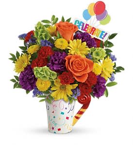 Celebrate You Bouquet - It's a party to go! Celebrate life's special moments with this fun, fabulous mix of roses, carnations and mums, hand-delivered in a festive, food-safe mug that will make their coffee breaks extra fun. Perfect for any festive occasion, from birthday parties to graduations to retirements!  SUBSTITUTION POLICY – Always deliver the freshest flowers! Please note the bouquet pictured reflects our original design.  If the exact flowers or container in this arrangement are not available, we will create a beautiful bouquet with the freshest available flowers.