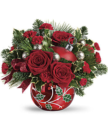 Deck The Holly Ornament Bouquet - Hand-glazed with a shimmering finish and jolly holly details, this keepsake ornament jar is a festive vase for a lush Christmas bouquet, then becomes a beloved home for holiday treats!  This festive bouquet includes red roses, red miniature carnations, variegated holly, noble fir, and white pine. Delivered in Teleflora's Deck the Holly Ornament.