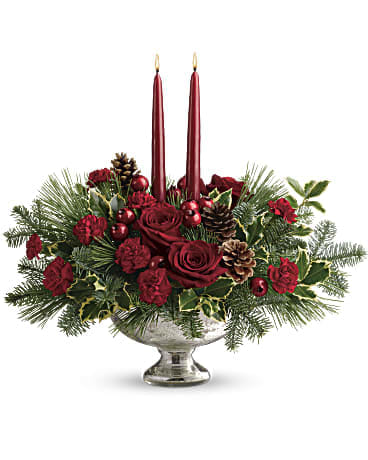 Shining Bright Centerpiece - Deck the halls with this elegant centerpiece of rich red roses and fresh Christmas greens, artistically arranged in a glorious mercury glass bowl with elegant taper candles.  This lush centerpiece showcases red roses, red miniature carnations, variegated holly, noble fir, and white pine. Delivered in a Mercury Glass bowl.  SUBSTITUTION POLICY – Always deliver the freshest flowers! Please note the bouquet pictured reflects our original design.  If the exact flowers or container in this arrangement are not available, we will create a beautiful bouquet with the freshest available flowers.