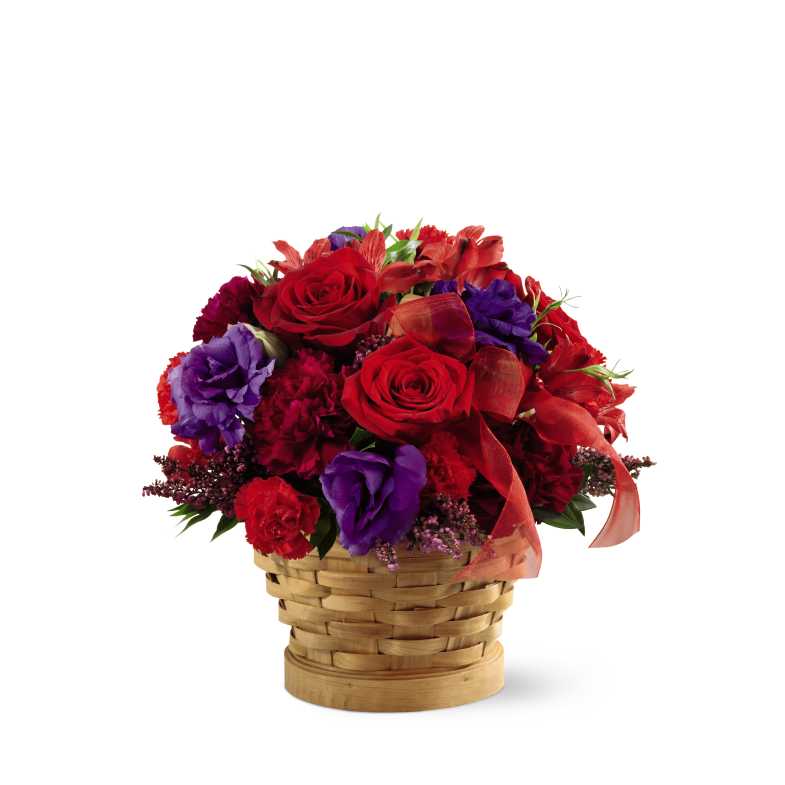 Basket of Dreams - The Basket of Dreams blooms with vibrant color to capture their every attention. Red roses, magenta carnations, red Peruvian lilies, purple double lisianthus, red mini carnations, heather and lush greens are beautifully arranged in a natural woodchip basket and accented with a sheer red ribbon to create a fantastic display of brilliant beauty. 