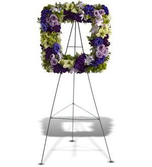 Picture of Heaven Standing Spray Picture of Heaven Standing Spray - A heavenly mix of fresh blooms in cool hues of green, purple and lavender is arranged into a picture-perfect wreath. Delivered on an easel, it's a modern take on a traditional standing spray and a charming tribute. A standing spray made of fresh flowers such as roses, hydrangea, gladioli, Dendrobium orchids, Bells of Ireland and lisianthus – in shades of green, purple and lavender – is delivered on an easel. Approximately 20" (W) x 20" (H) (Dimensions do not include easel.)