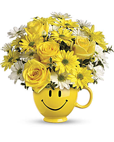 Be Happy Mug Bouquet - When you're looking to make someone smile, this happy face mug of roses and daisies is tops. Sure to cheer up everyone from a beloved wife to a busy boss, these are also great flowers for kids. Yellow roses and daisy spray chrysanthemums along with white daisy spray chrysanthemums and oregonia are delivered in Teleflora's one and only yellow happy face, Be Happy® mug.