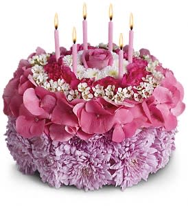 Your Special Day  - Tell the birthday girl to make a wish on these candles! Made entirely of fresh flowers, this delightful &quot;cake&quot; will really make her day special.  The recipe for this cake includes a pink rose and hydrangea, hot pink miniature carnations, white button spray chrysanthemums and waxflower and lavender cushion spray chrysanthemums. This tasteful arrangement even comes with its own hot pink candles. It's everything a girl could wish for!   SUBSTITUTION POLICY – Always deliver the freshest flowers! Please note the bouquet pictured reflects our original design.  If the exact flowers or container in this arrangement are not available, we will create a beautiful bouquet with the freshest available flowers.