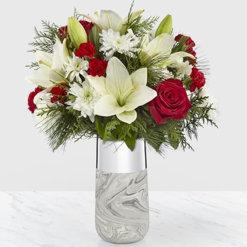 Dreaming Holiday Bouquet Dreaming Holiday Bouquet - It's a beautiful assortment of flowers for any occasion that is more than a dream, it's a dream come true. The marble-patterned ceramic cylinder is completed by a silver metallic band wrapped around the top.