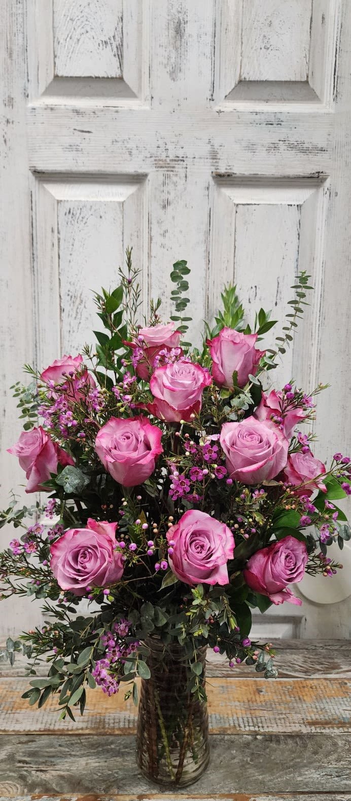 Pink Dozen Pink Dozen - 12 of the tallest pink roses mixed in a garden of greens and wildflower filler!