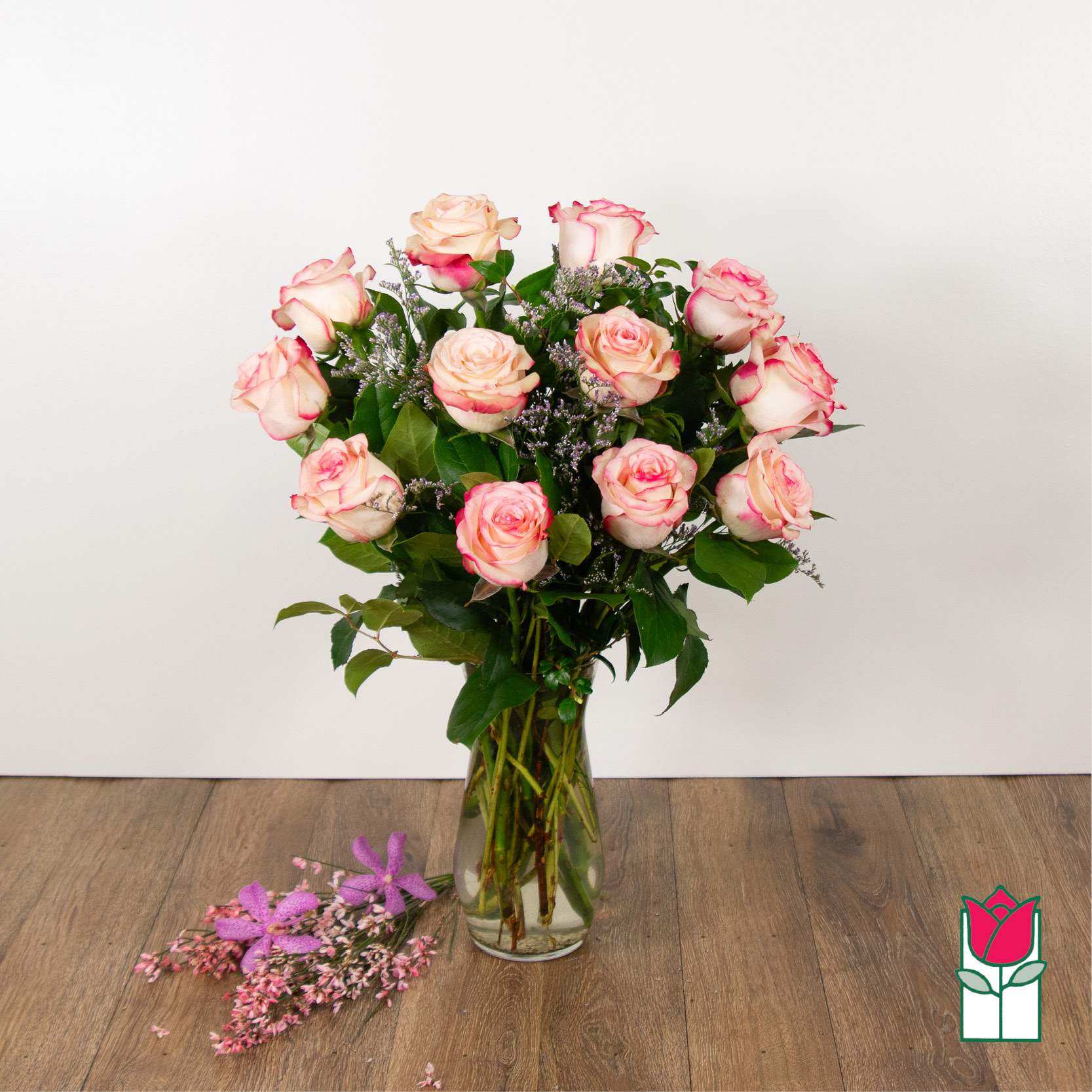 Beretania's Medium Stem Rose Arr - Pink (Hue Varies) - Indulge in the timeless elegance of our Medium Stem Rose Arrangement, meticulously designed to captivate and inspire. Each exquisite arrangement is presented in a graceful glass vase, showcasing the natural beauty of our carefully selected roses. We take pride in sourcing the highest quality roses from around the world, ensuring that every bloom is a testament to luxury and sophistication.  Choose from a variety of captivating colors to personalize your arrangement, whether you prefer the classic allure of red, the soft romance of pink, or the purity of white. Our diverse range allows you to tailor this floral masterpiece to your unique style and preferences.  Convenience meets luxury with Beretania Florist. Enjoy the flexibility of ordering for pick-up or experience the ease of our convenient delivery service in the Honolulu area. Whether adorning your space or sending heartfelt sentiments to a loved one, our Medium Stem Rose Arrangement promises to elevate any occasion with its beauty and grace. Trust us to deliver not just flowers, but an exquisite floral experience that brightens your day.