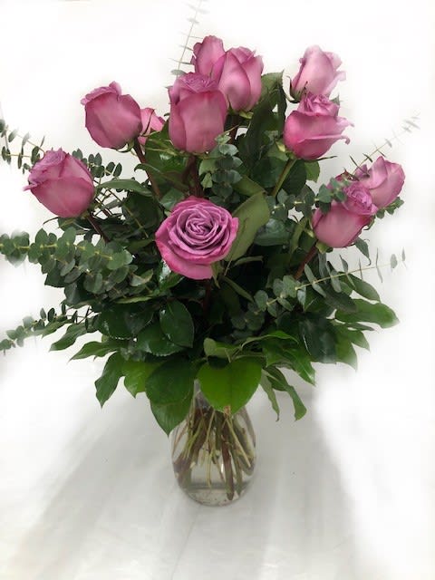 Lavender Wishes - Dozen Premium Lavender Roses Lavender Wishes - Dozen Premium Lavender Roses - Lovely lavender roses are enchanting and exotic. They can even signify love at first sight and when this pretty bouquet is delivered it will surely be love. Gorgeous as the roses are by themselves when mixed with the dark forest green of eucalyptus the effect is intoxicating. T68-1A