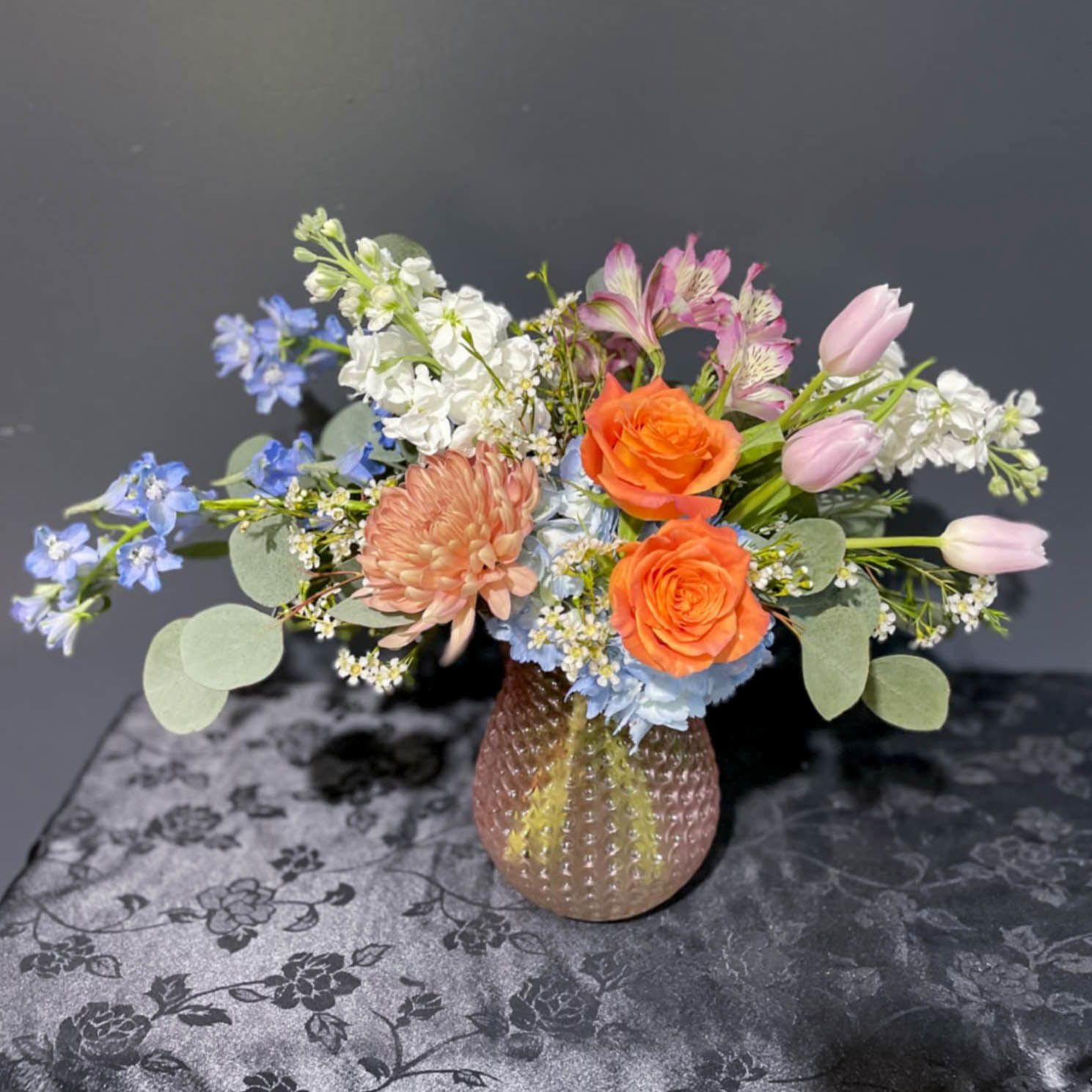 Free Spirit - Free Spirit lives up to it's name with Free Spirit Roses and it's free flow of it's design in a rose gold glass vase that adds the perfect color to such a beautifully spirited design!