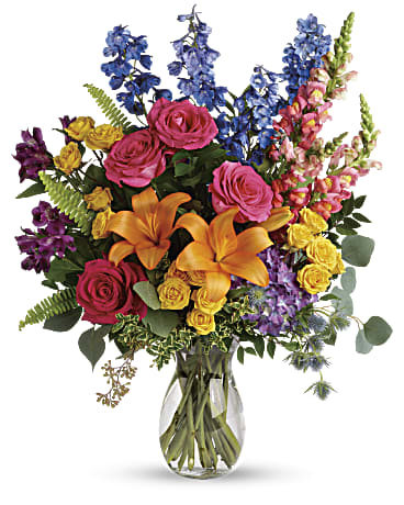 Colors Of The Rainbow Bouquet Colors Of The Rainbow Bouquet - A rainbow of beauty for any occasion. Purple hydrangea, pink roses and orange lilies positively pop in this bright bouquet, featuring all the colors of the rainbow. This colorful bouquet includes purple hydrangea, pink roses, yellow spray roses, orange asiatic lilies, purple alstroemeria, blue delphinium, pink snapdragons, blue eryngium, huckleberry, oregonia, Israeli ruscus, sword fern, silver dollar eucalyptus, seeded eucalyptus, and lemon leaf. Delivered in a jordan vase. Orientation: All-Around