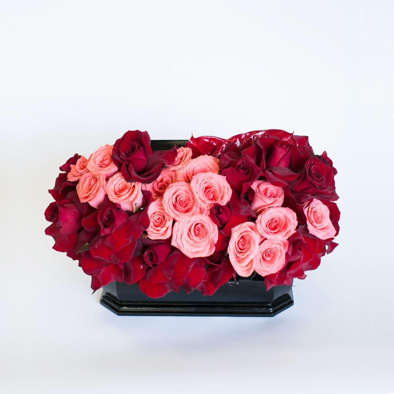 Boxed Treasure - This arrangement of Red roses, peach roses, and red anthurium is perfect for any occasion to send to that special someone