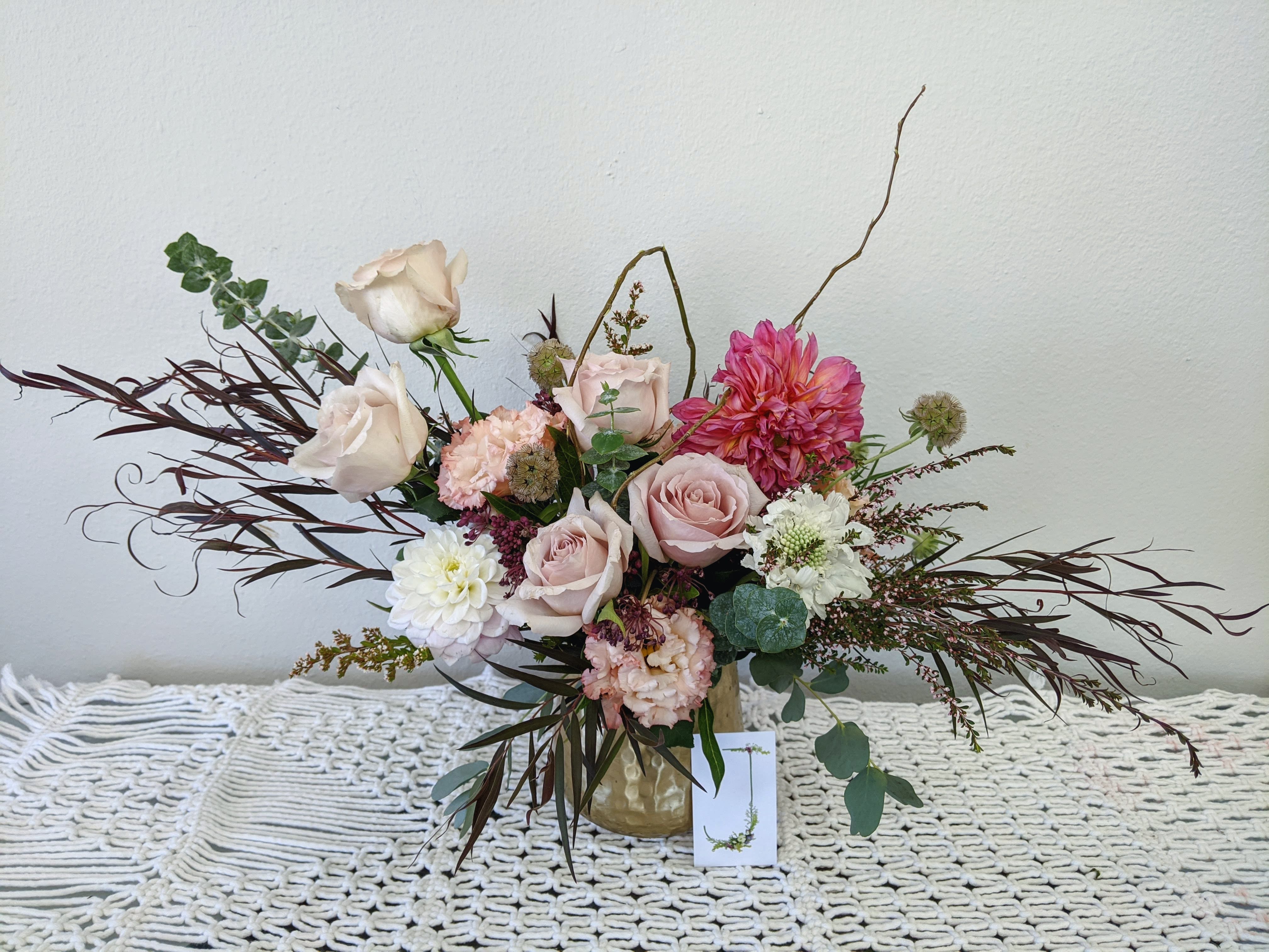 Pop of Pink - A muted toned arrangement with a pop of pink in a gold vase. (Business card for scale)