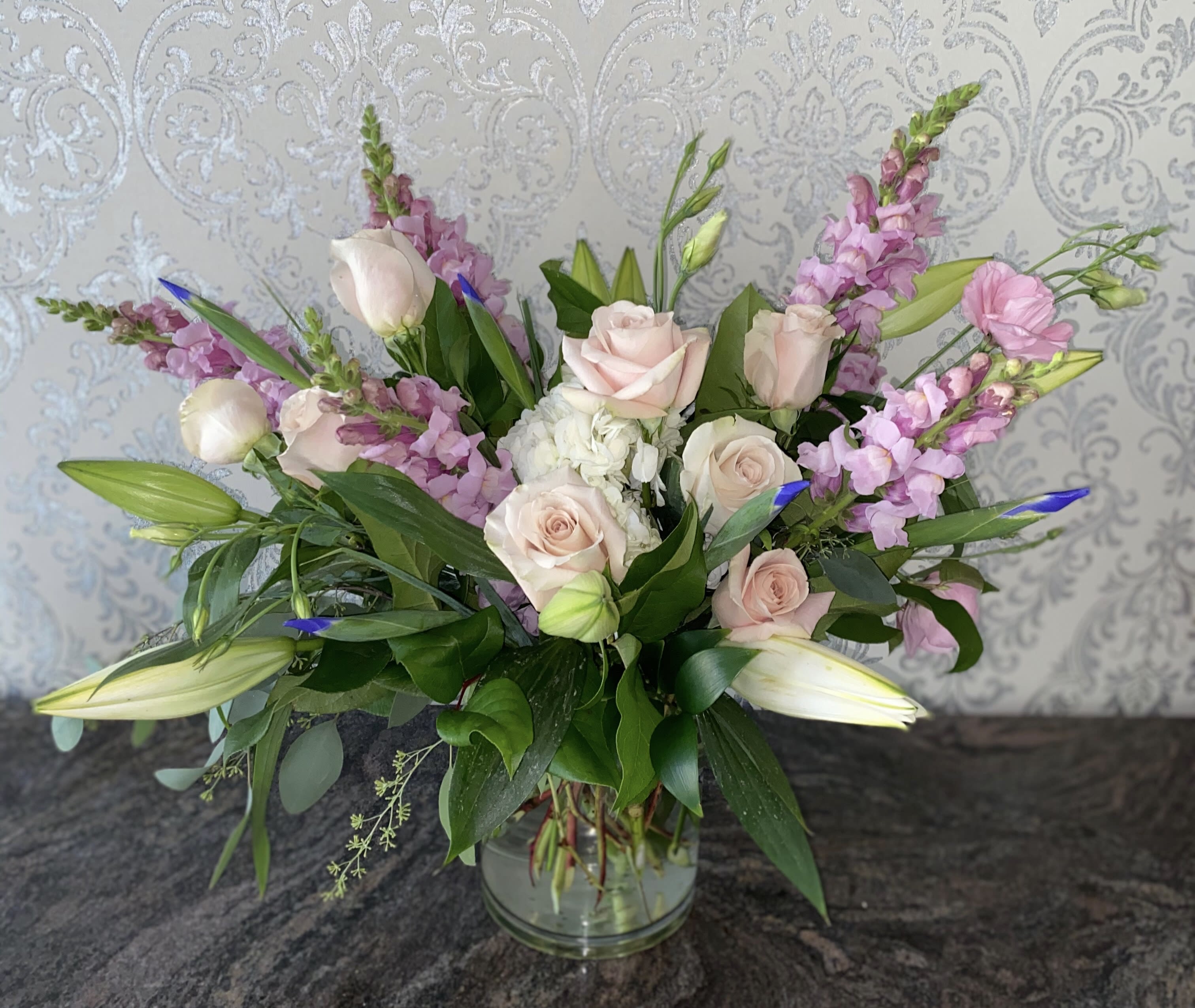 New Day - Arrangement of roses, lilies, iris, snapdragons, hydrangea
