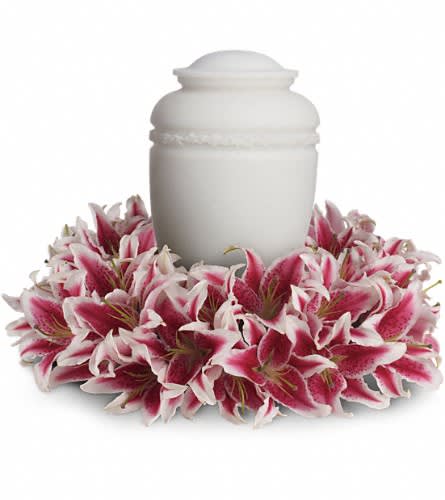 Glorious Life Wreath - Bring the gift of grace to the service with this serenely lovely wreath of fragrant pink lilies. It is a fitting tribute to someone loved by so many. The beautiful arrangement includes 25 stems of light pink oriental lilies mounted on a 15&quot; wreath base. The urn is not included.