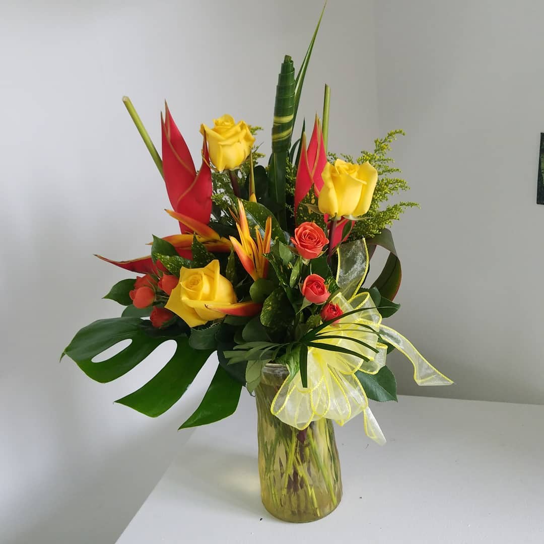 Island Escape - This wonderful array of exotic flowers is a contemporary work of floral art inspired by the beauty of these tropical varieties. Each arrangement is unique, using what tropical flowers are available to us. Send your special someone something a little out of the ordinary with our beautiful Island Escape.