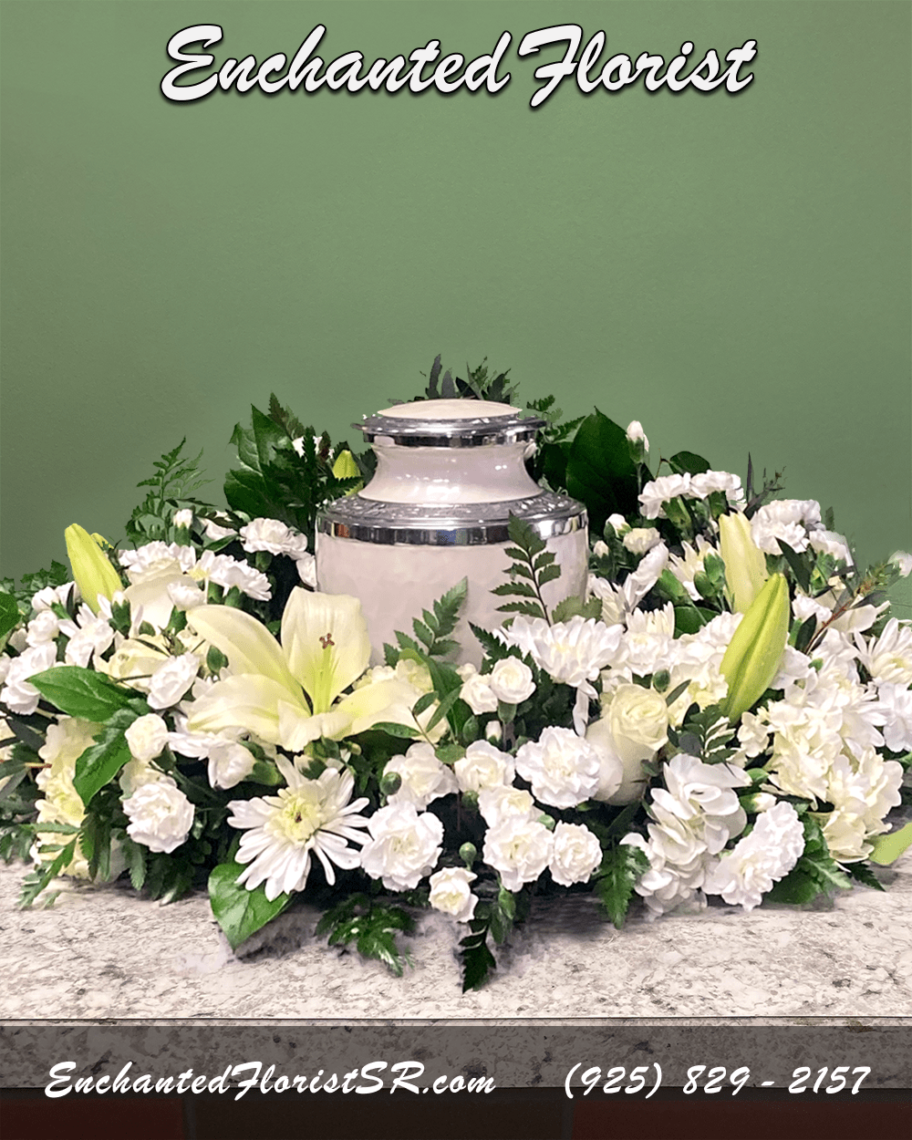 Bountiful - Urn Wreath - A tranquil urn wreath that honors cherished memories with grace, showcasing a pristine all-white palette. Featuring chrysanthemums, roses, carnations, hydrangeas and astatic lilies. This tribute is accented with verdant leather fern, lemon leaf and eucalyptus gunnii.  Urn wreaths are traditionally ordered by immediate family members, and are sent to reception sites before the ceremony begins. Intended to be set on a flat surface, with an urn or framed photo placed within the wreath center, creating a loving tribute and providing solace and comfort during times of loss.  Please Note: Urn wreath does not include urn.  Approximate Dimensions: 10&quot; Wreath Height 28&quot; Wreath Diameter