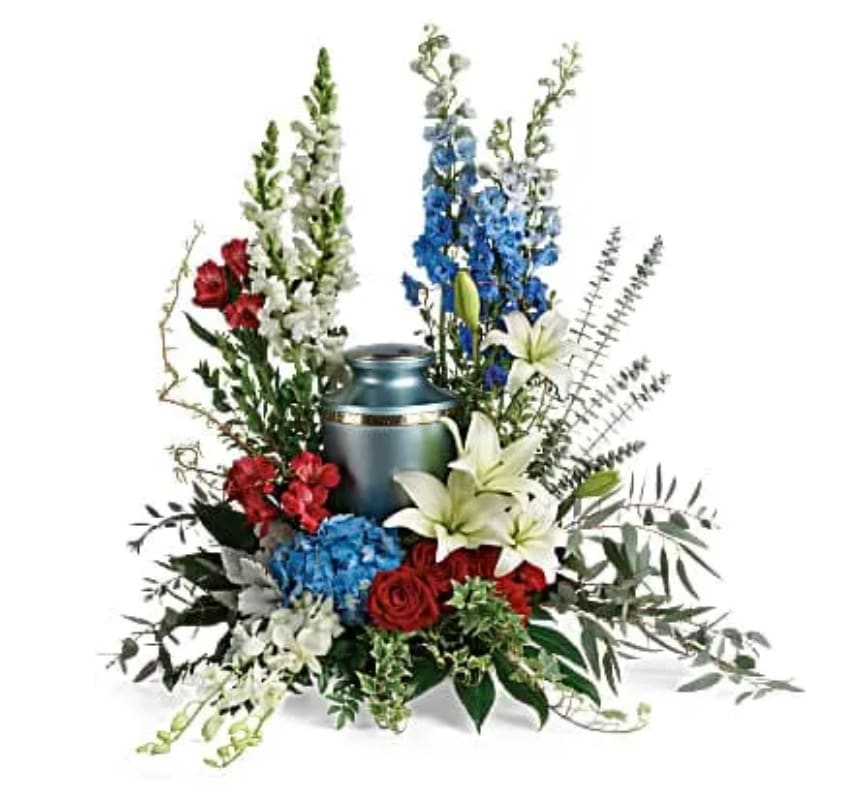 Reflections Of Honor Cremation Tribute - Proud and patriotic, this boldly designed red, white and blue bouquet displays the cremation urn with honor. This patriotic tribute includes blue hydrangea, white dendrobium orchids, red roses, white asiatic lilies, red alstroemeria, red carnations, blue delphinium, white snapdragons, dusty miller, myrtle, huckleberry, variegated ivy, curly willow, aralia leaves, parvifolia eucalyptus, spiral eucalyptus, and lemon leaf. Arrangement does not include urn.