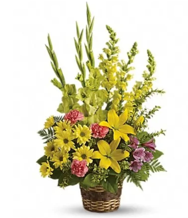 Vivid Recollections Vivid Recollections - This glorious basket of beautiful blossoms will send hope and let those you care for know that grief is a path they needn't walk alone. Bright flowers such as yellow asiatic lilies, snapdragons and daisy spray chrysanthemums along with green gladioli, purple alstroemeria and fresh greenery are beautifully delivered in a natural basket.