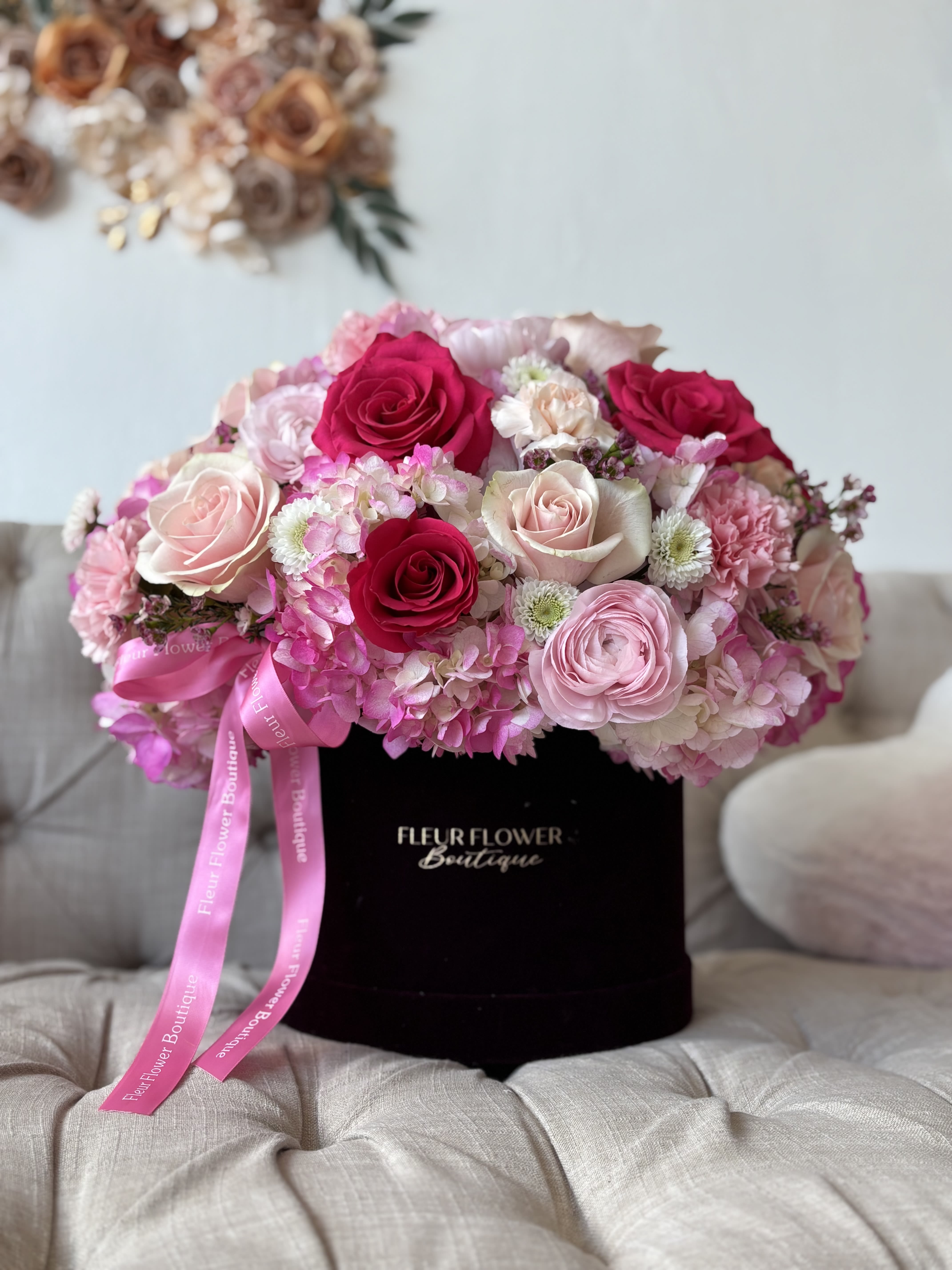 Enchanted  - This charming arrangement of flowers combines the softness of pink with the intensity of fuchsia, creating a harmonious explosion of vibrant colors. Each carefully selected flower conveys elegance and freshness, making it the perfect gift for any special occasion. Its delicate blend of romantic and modern tones adds a unique touch of beauty that captivates anyone who receives it.