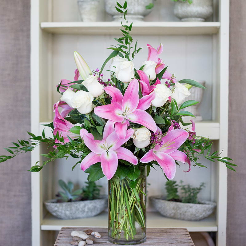 Enchantment Enchantment - Roses and lilies. Other colors may be available.