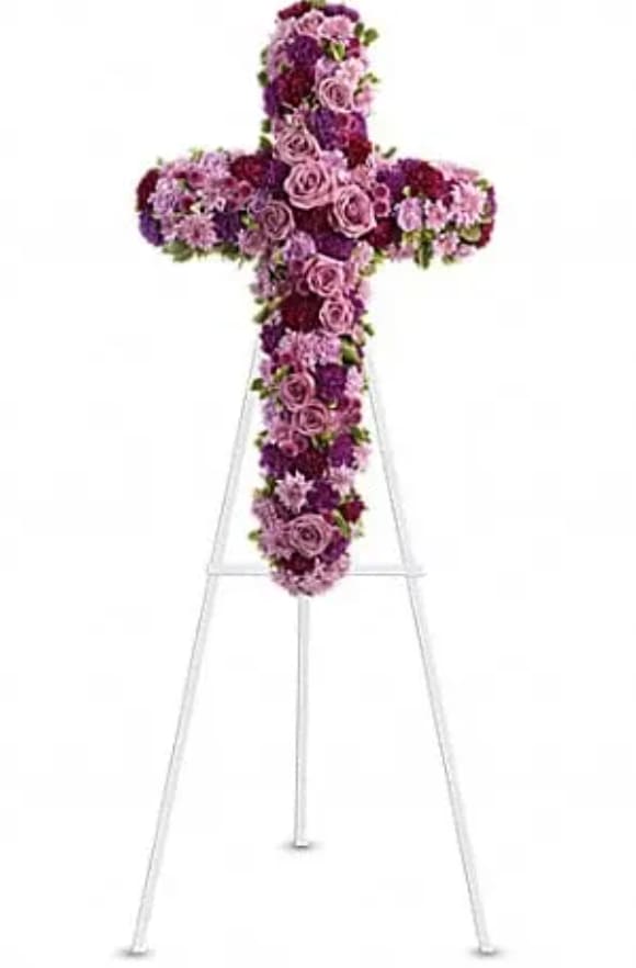 Deepest Faith Deepest Faith - Pride, dignity, admiration and faith are on beautiful display in this moving sympathy arrangement. It's a meaningful way to deliver your heartfelt message. Beautiful flowers such as lavender roses, carnations and cushion spray chrysanthemums along with fuchsia and purple carnations and button spray chrysanthemums create a dazzling cross that is full of hope and devotion.