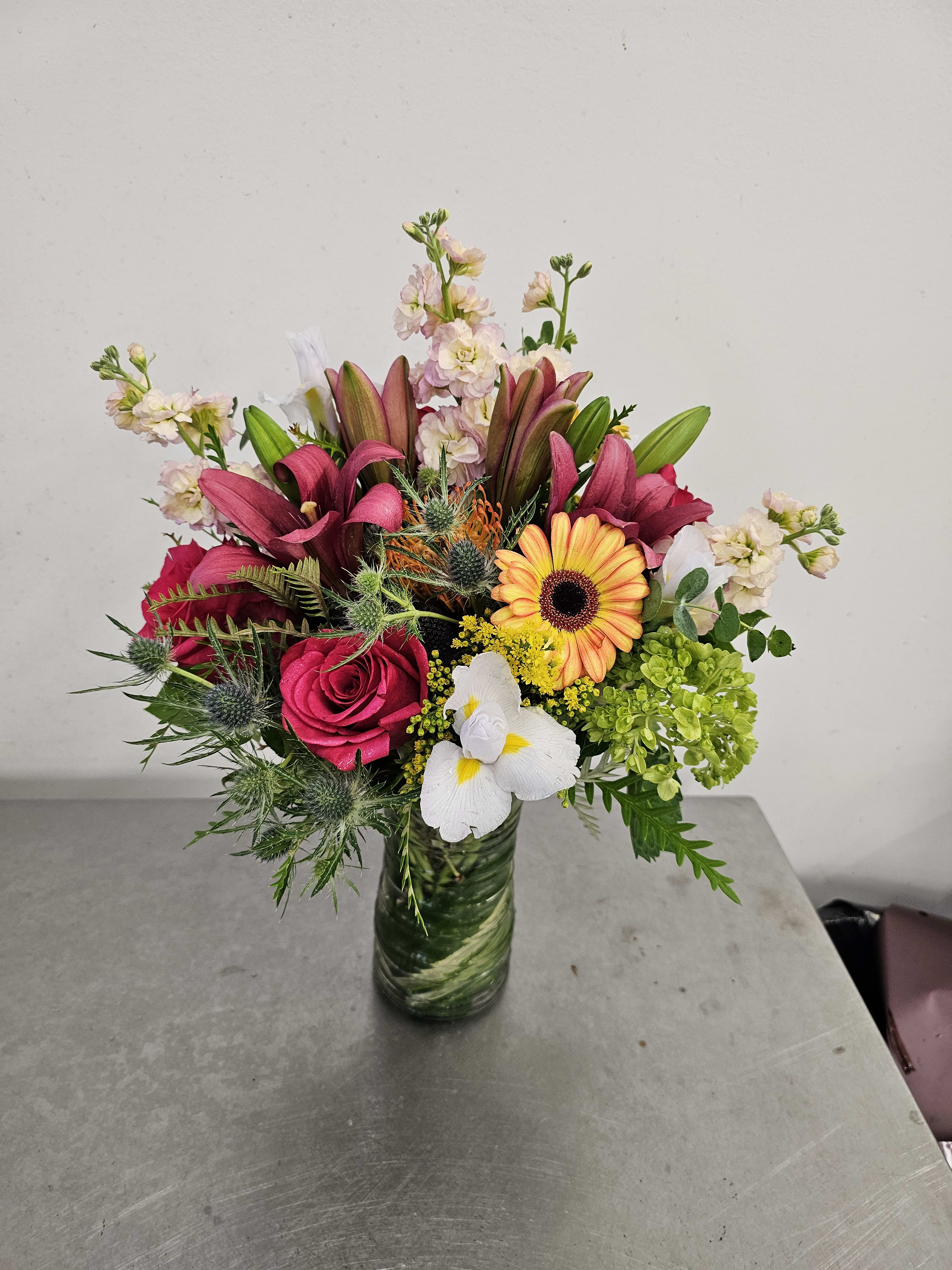Sparky Beautiful By kokee -  A medium  vase arrangement,  well mixs of flowers  likes,  stocks,  and all involved  in a green leaf  onside  of the vase 