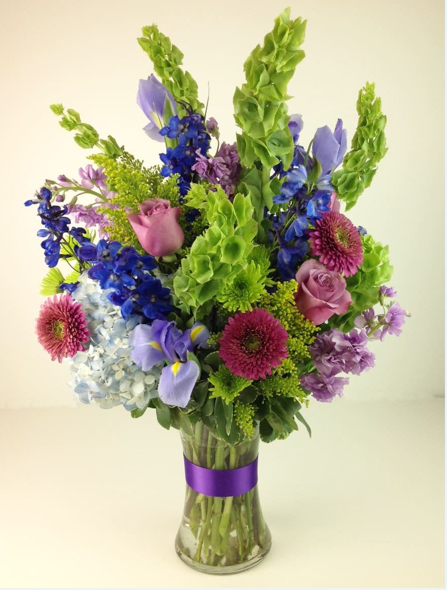 Garden of Bells By Kokee Garden of Bells By Kokee - Bells of Ireland and other tall flowers like delphinium stocks and waxs
