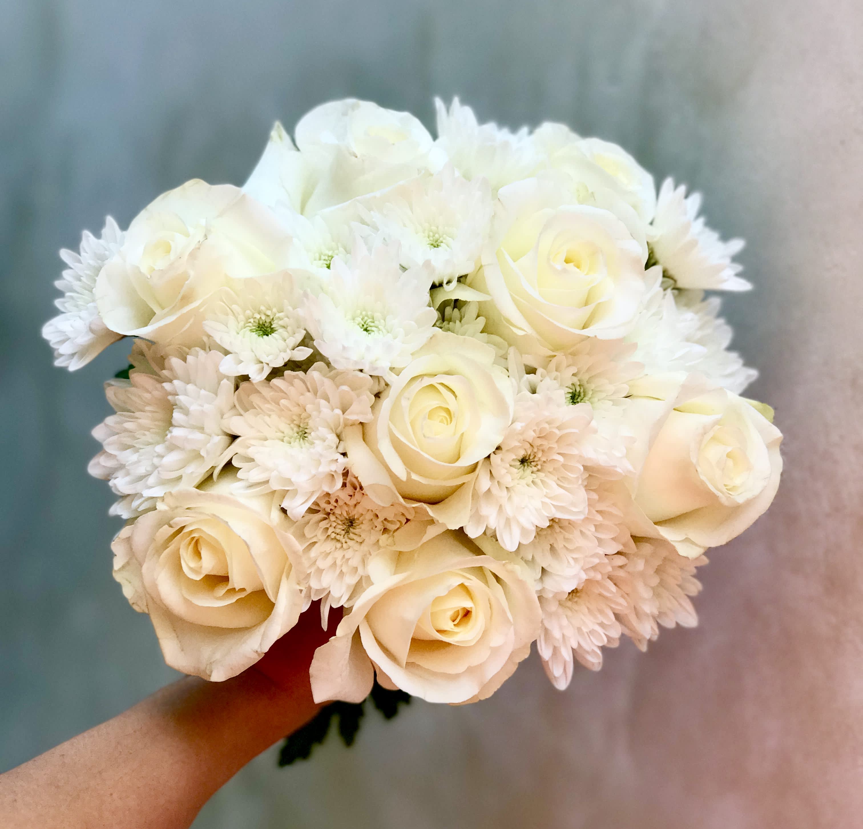 Pure Love - A lovely arrangement featuring all blooms in white that looks and feel clean, pure and fresh. A perfect arrangement for someone who doesn't have a preferred color or gender.   Bouquet will either come in elegant wrapping and bow or in a nice vase. You can specify your preference in the notes when placing an order.