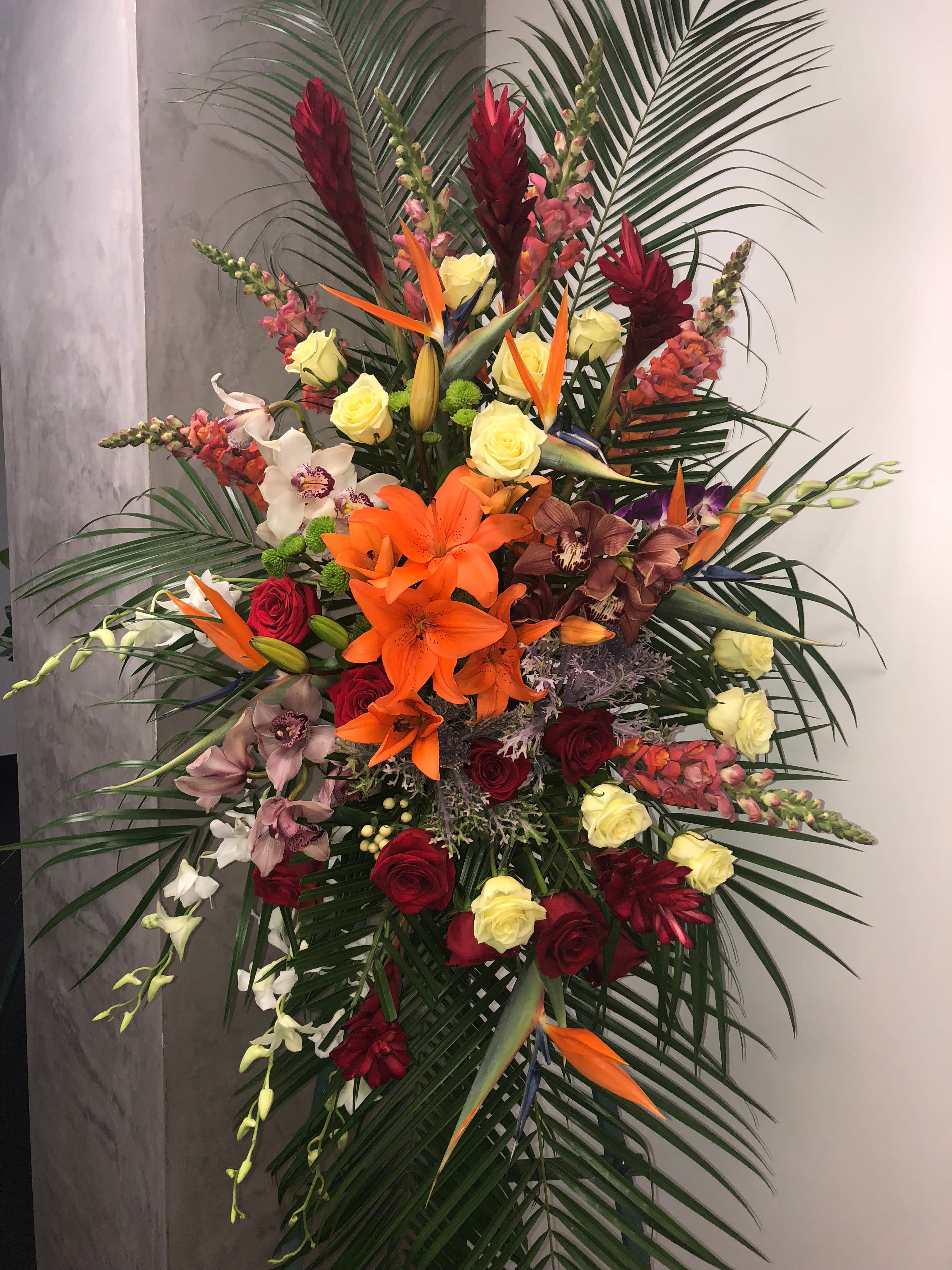 Tropical beauty spray by Seulberger Tropical beauty spray by Seulberger - A magnificent and colorful display of flowers arranged with love and affection to express your love for the one you miss dearly now.Tropical flowers such as ginger flowers,birds of paradise and orchids are used in this spray.