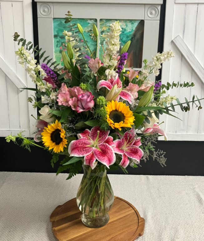 She is Beauty - She is beauty, she is grace! This arrangement is handcrafted with luxurious flowers, perfect for any important woman in your life.