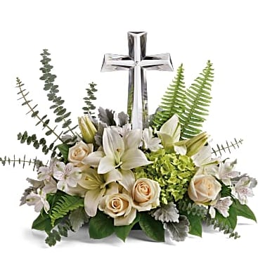 Life's Glory  - This reverent bouquet of serene white flowers is a beautiful sharing of sympathy, adorned with a majestic crystal cross keepsake. Green and White flowers are designed artfully around a Crystal Cross Keepsake.