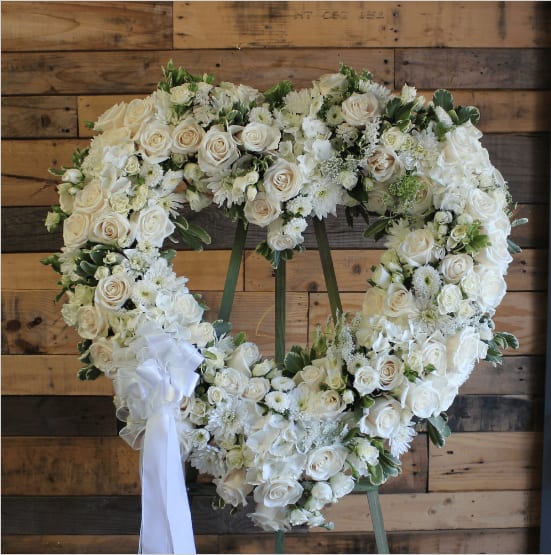 Everlasting Love - This peaceful heart wreath contains all white flowers to show your eternal love and sympathy at the service.