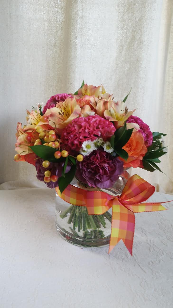 Blooms in Pink and Orange  - Nosegay of roses, berries, asters, carnations, alstroemeria, and other flowers.