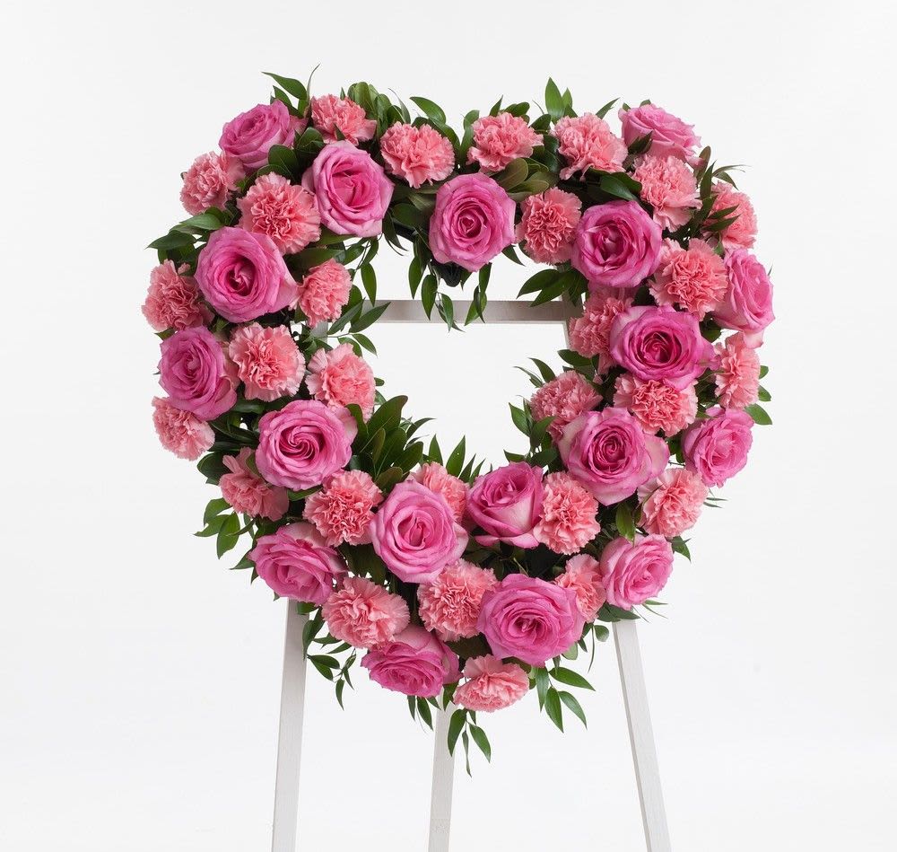Radiant Harvest - Exquisite heart-shaped arrangement of pink roses, elegantly crafted to celebrate any occasion with grace and beauty.
