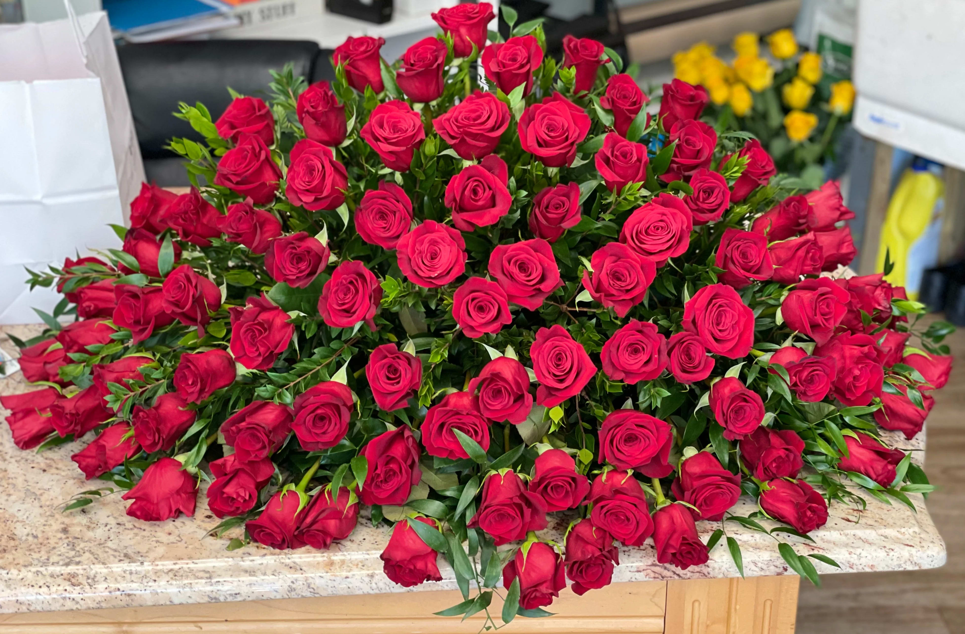 Red Rose Casket Spray Red Rose Casket Spray - Honor the memory of your loved one with a all red rose Casket Spray. We advise our customers to order 24-48 hours in advance of their scheduled delivery to ensure that we are able to have similar flowers and colors in the shop for their order. $350 as shown