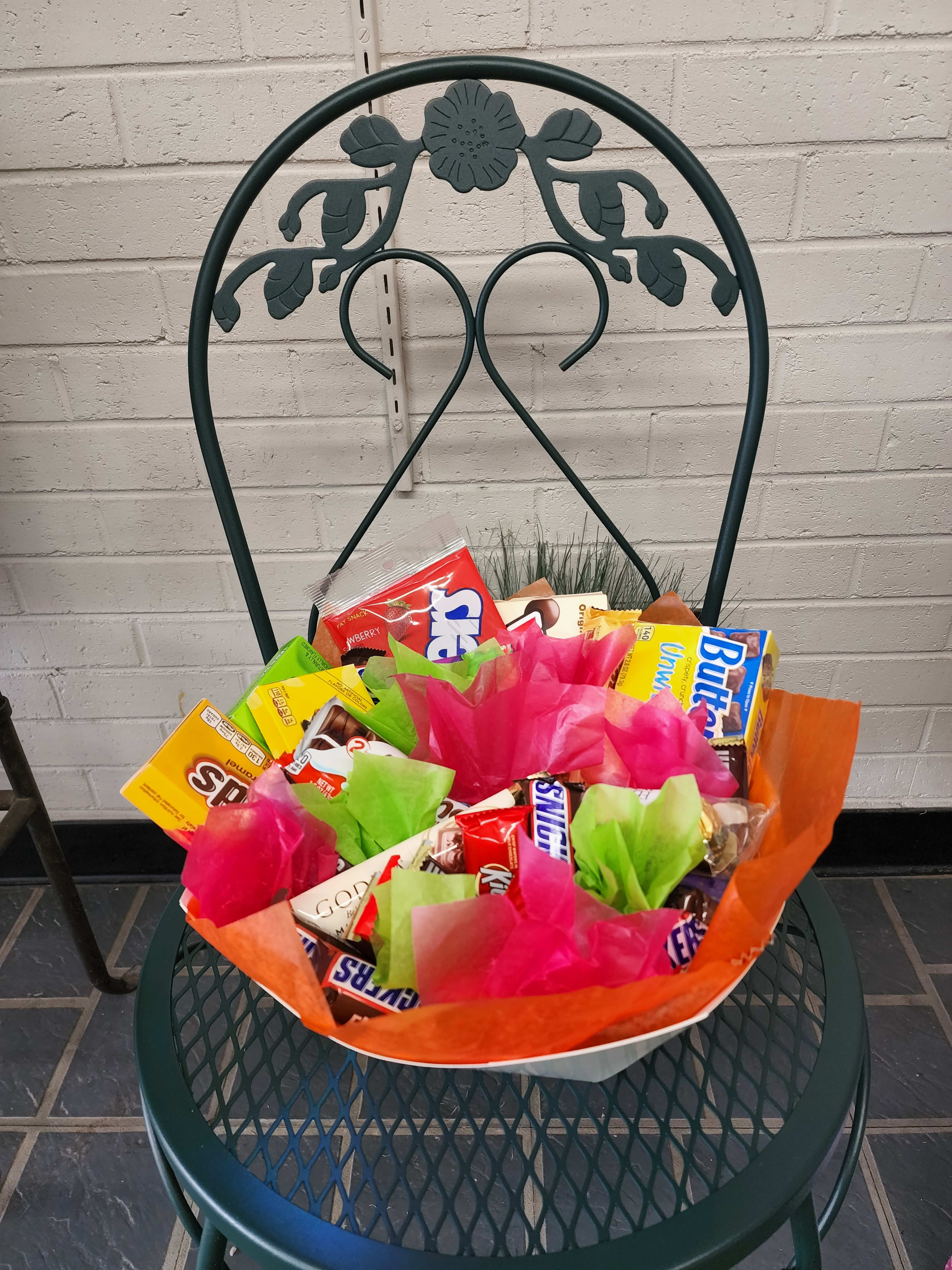 Snack Attack - A great gift idea for any chocolate lover!!! Snickers, Twizzlers, Whoppers, Raisonettes, Hershey's, Godiva, and Toblerone are just some of the items in this sweet treat basket! Items may vary due to availability. Deluxe version shown. 