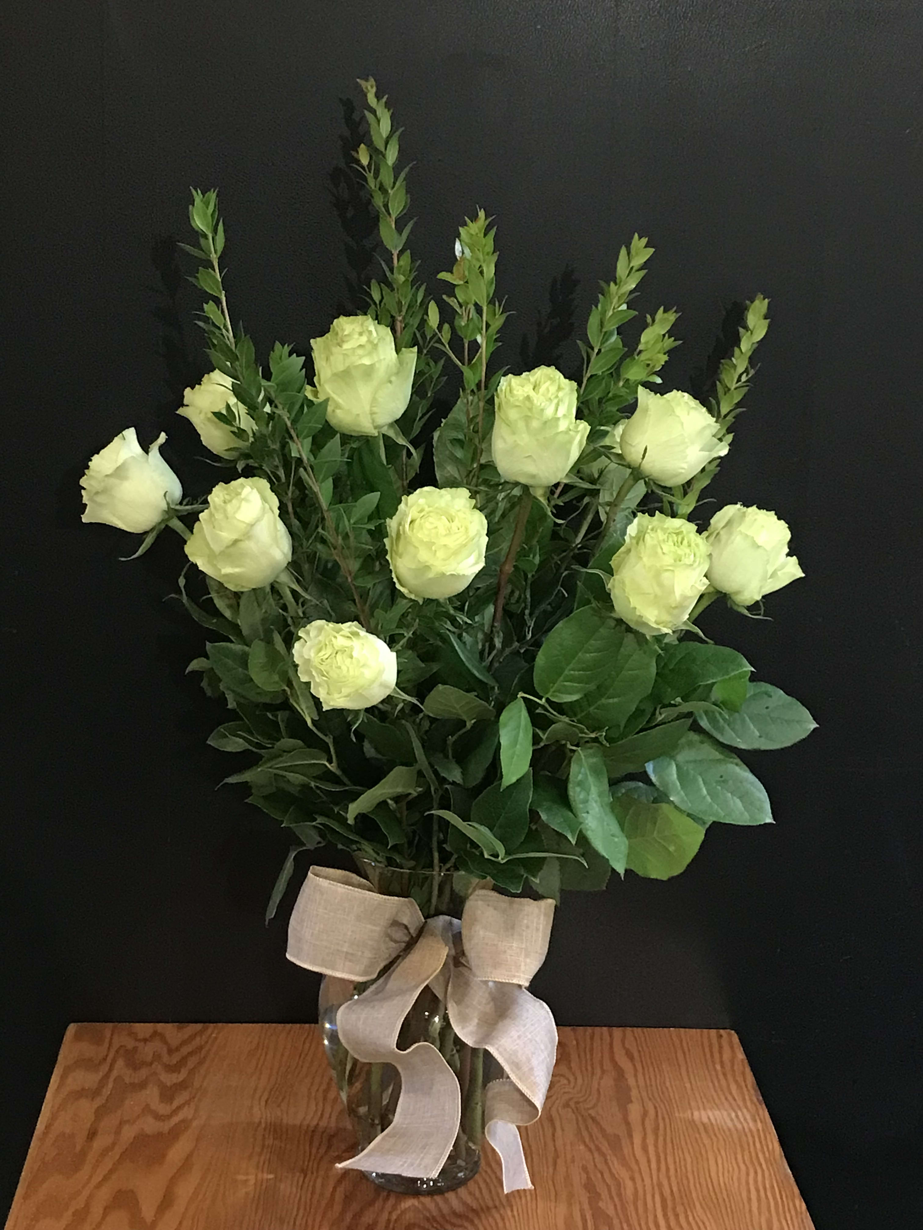 Lemonade roses Lemonade roses - These Natural green roses are just so beautiful. Soft and elegant , perfect for any occasion. You will not be disappointed. Sophisticated and stunning, creating a gift of classic beauty they'll simply never forget. A dozen roses with premium mix greens are arranged in a classic urn vase and finished with a matching ribbon. All our roses are open cut roses, which means they are on the plant longer. This allows them to be a stronger cut flower and have a longer vase life.