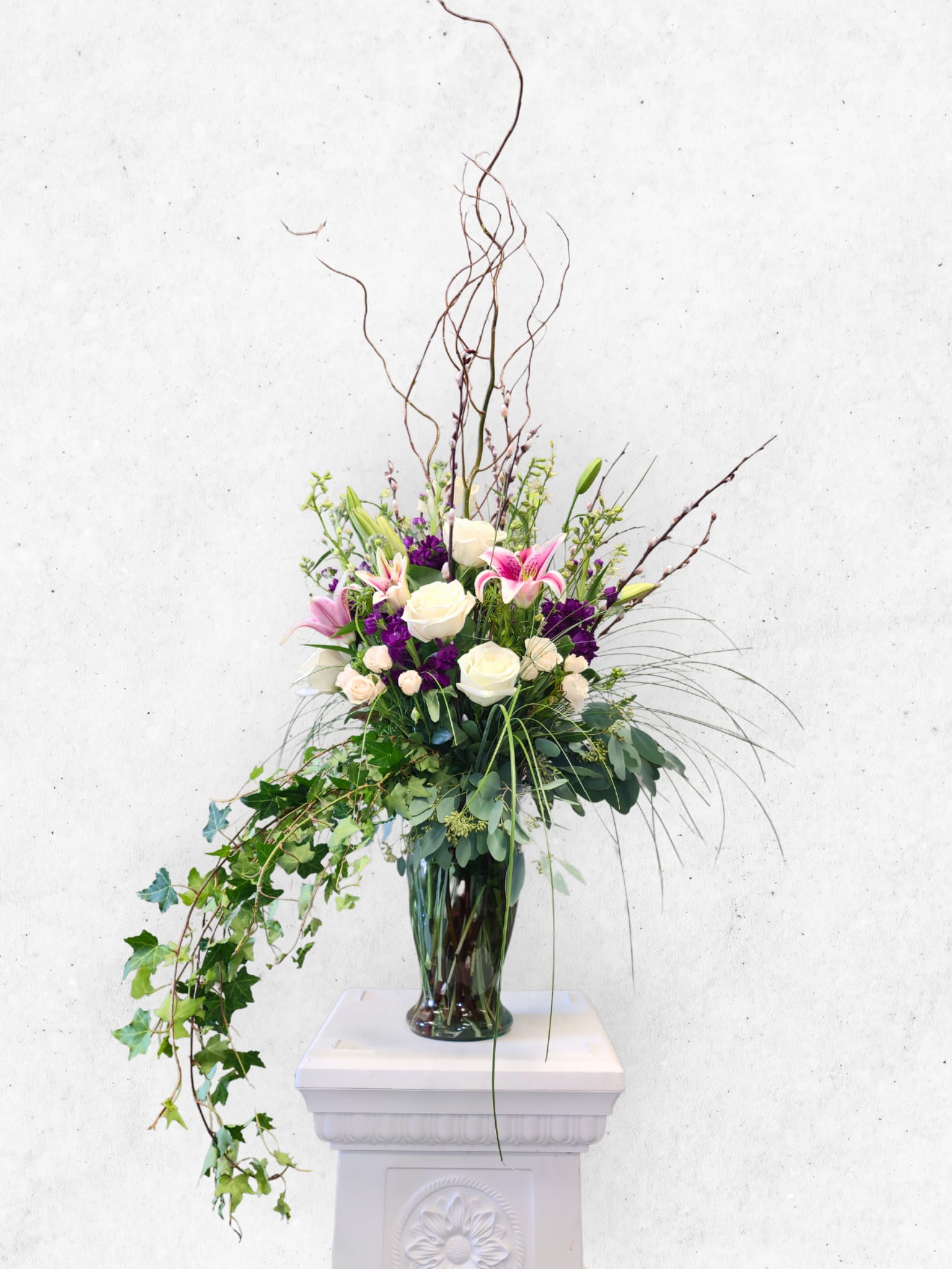 Statuesque Garden Flower Vase  - Tall glass vase of garden flowers soft shades for sympathy or any occasion. 