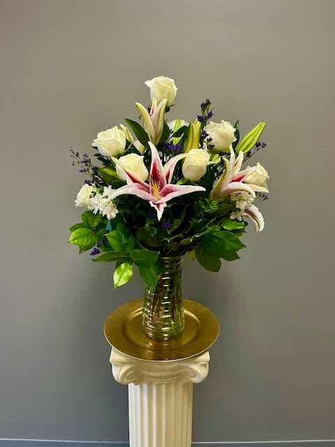 Starstruck - Stargazer Lilies and white Roses accented by lush greens and accent flowers.