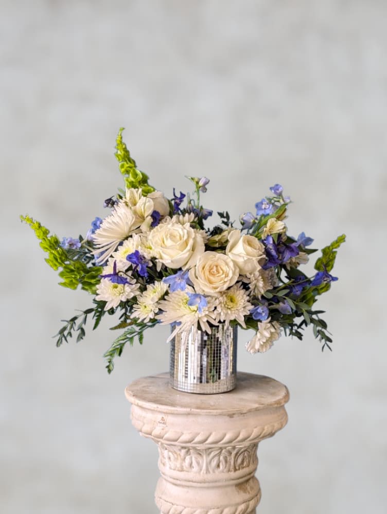 Peaceful Heart by Art &amp; Flowers - Calming blues, whites and greens are artfully arranged in a glass vase for a modern and refreshing look. This is a wonderful choice for any occasion.   Flowers include a mix of roses, alstromeria, daisies, carnations and more. We use a variety of blooms in whites, blues and greens for this lovely arrangement. 