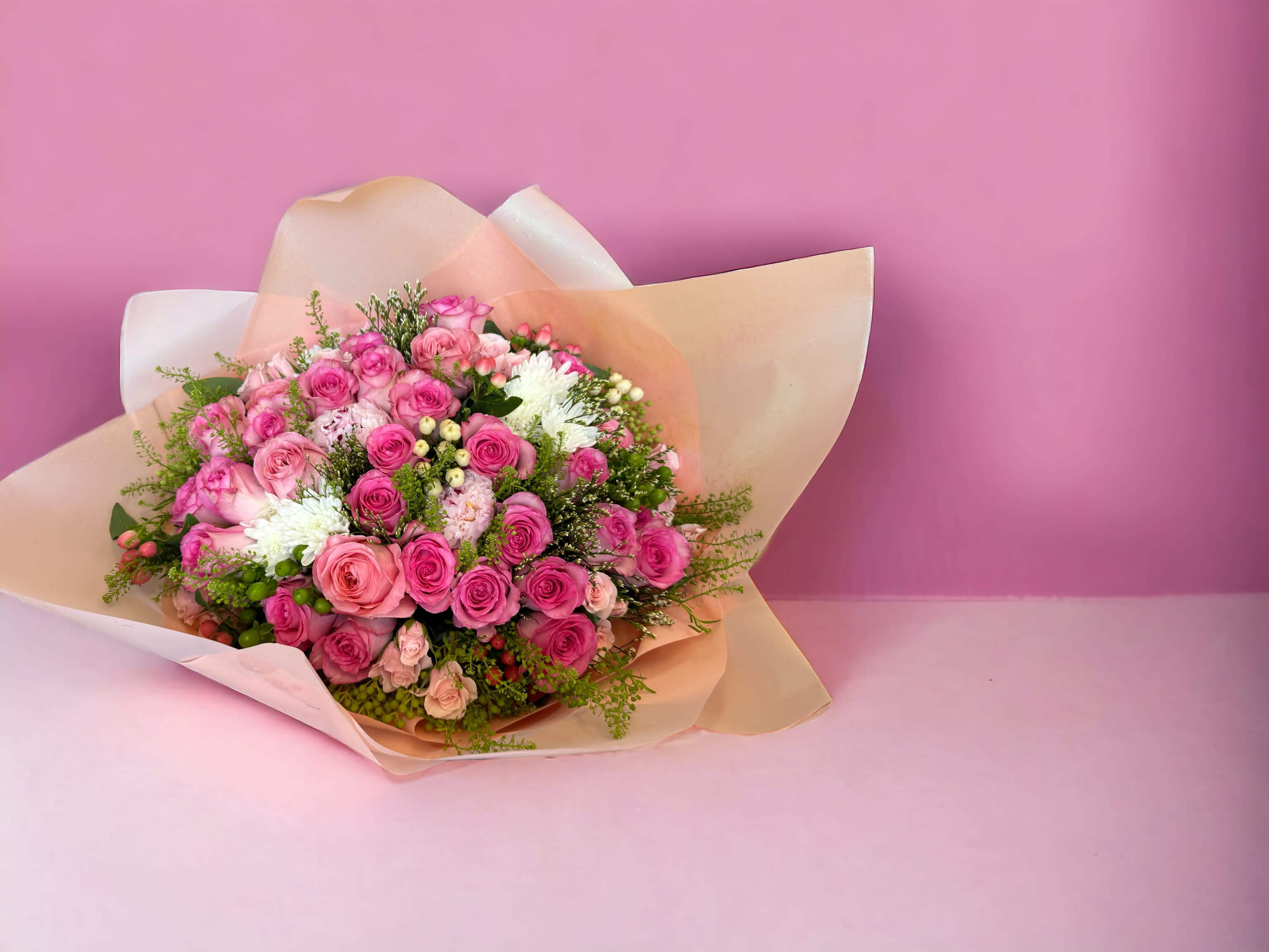 Big Pink roses bouquet - A combination of 30 pink roses and greens for someone special. Deluxe is 36 roses. Premium is 50 roses. (Please pre-order a day ahead for Premium or call to check before placing your order to avoid long wait time. Thank you!) **Shade of pink may vary**  We offer different colors and styles for wrapping paper. Please note in Florist Instructions your choice of wrapping paper. We have one solid color like red, pink, white, classic brown, clear, etc. We also have two side colors like white/gold, light pink/hot pink, pink/purple, blue/white etc. And lastly, we have them in shiny/iridescent colors, or texture/style paper. Call us at 323-961-6686 if you have any questions.