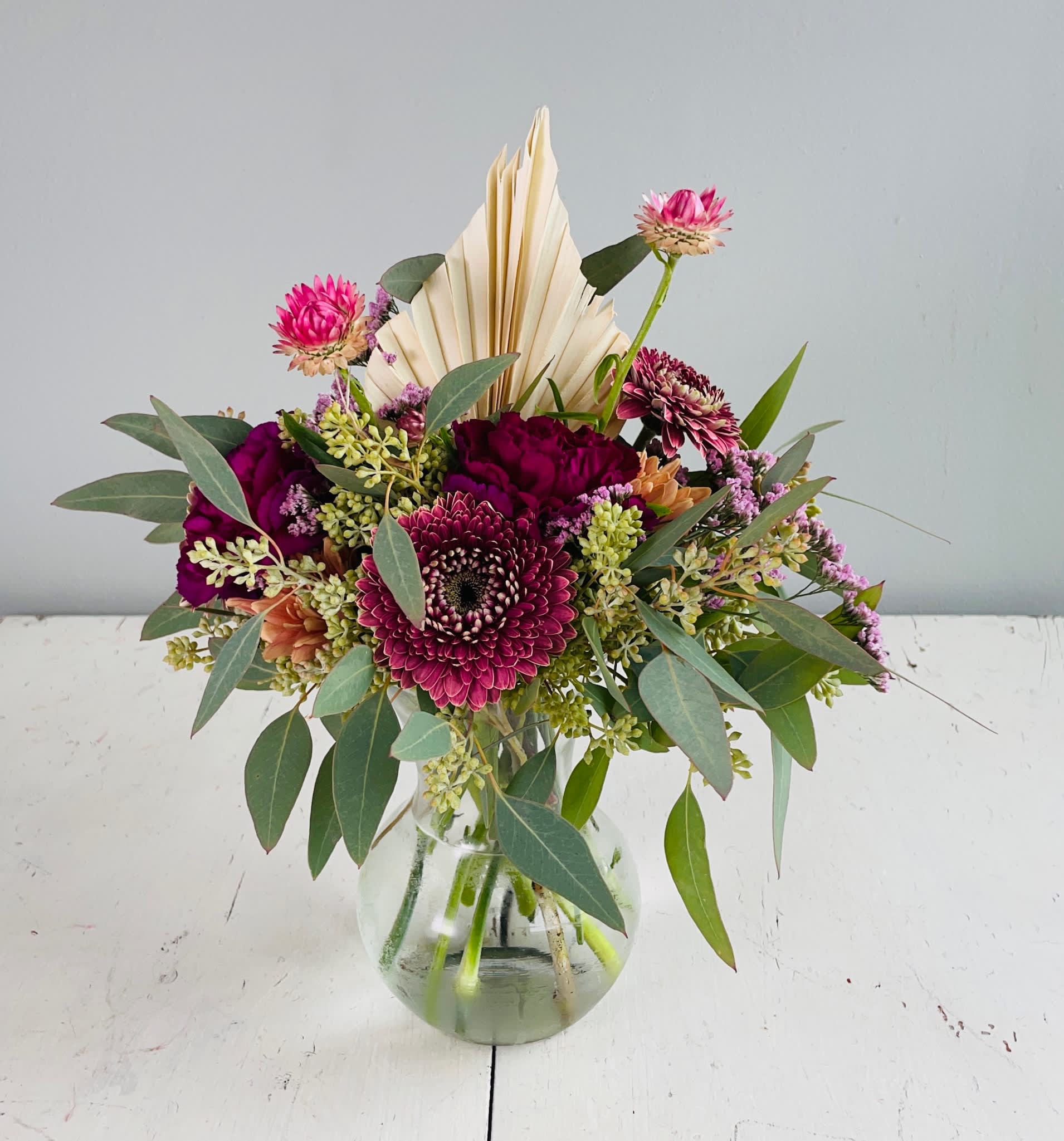Petite n Pretty - She is petite and pretty with a mix of berry toned blooms! Perfect for a bedside table or desk!