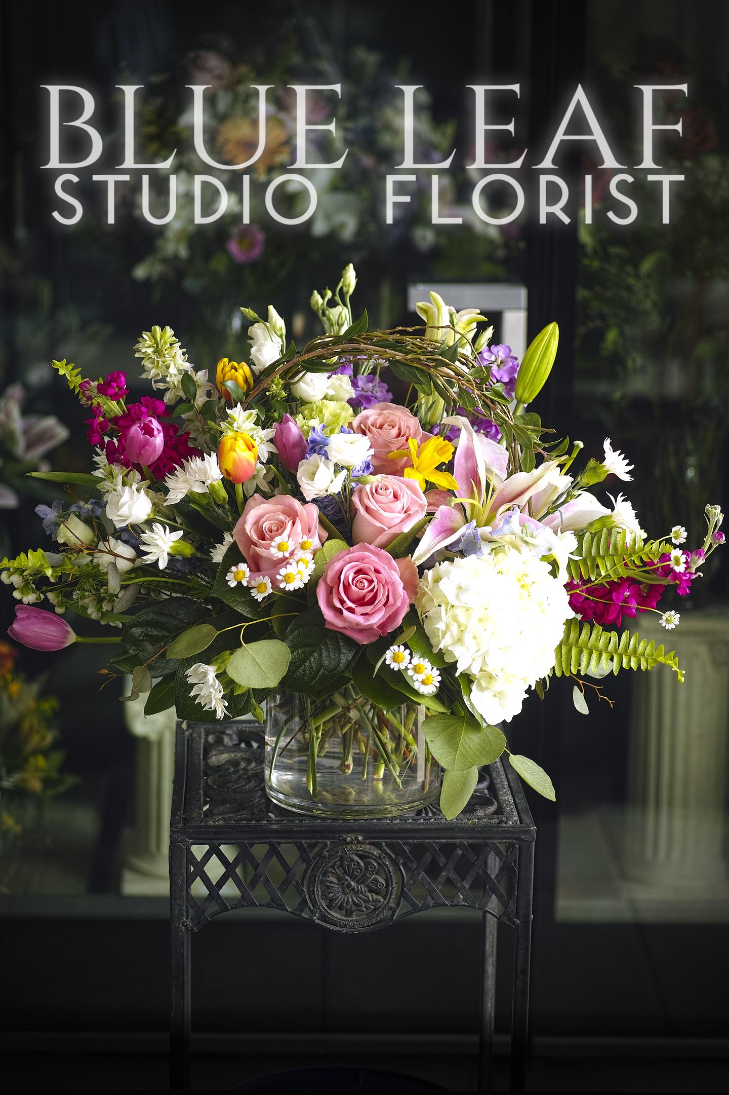 Spring in Bloom Spring in Bloom - Bursting floral celebration of an assortment of Spring flowers. This arrangement is predominately one sided.