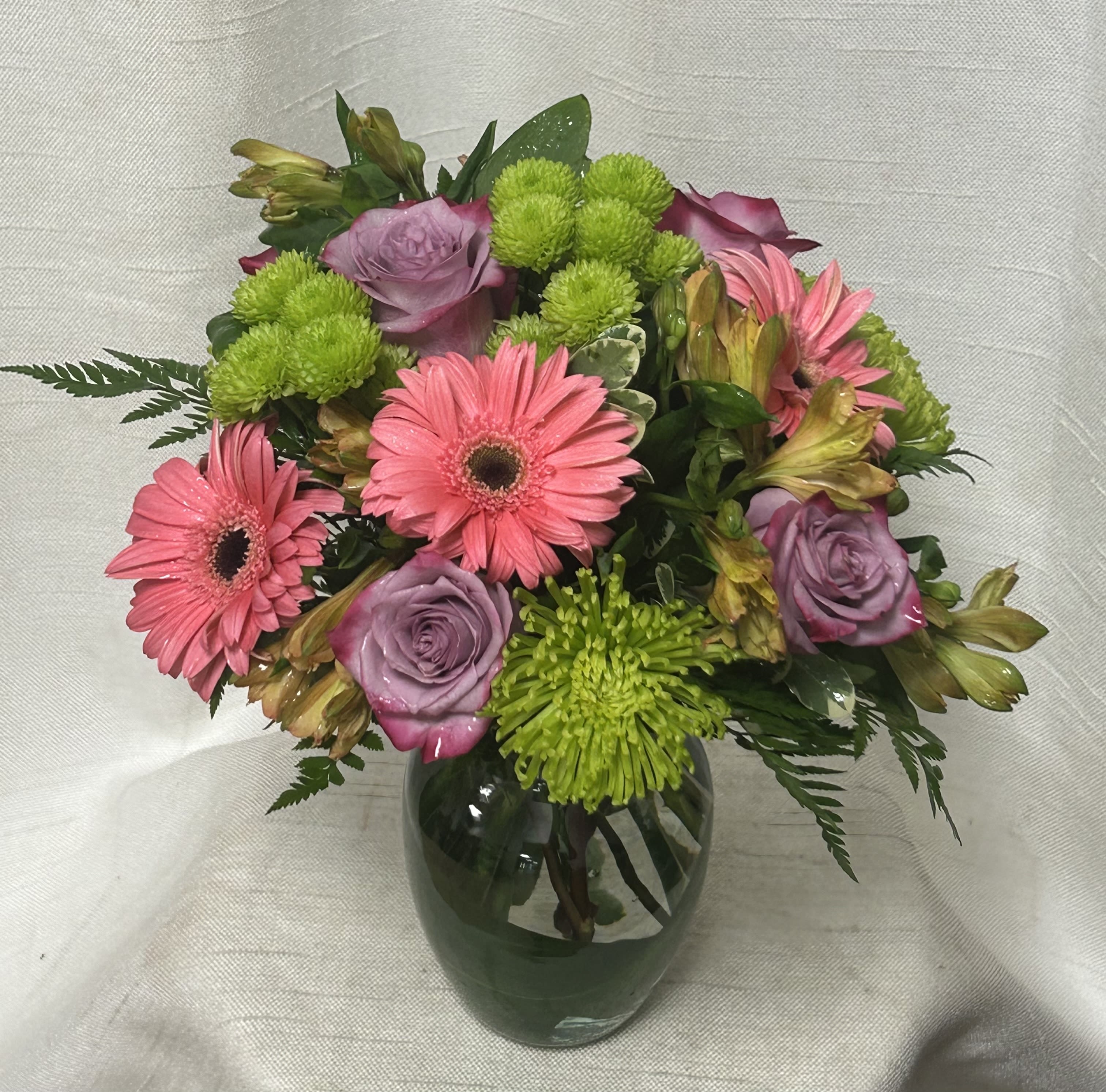 Color Cascade - Experience an explosion of hues and vibrancy with our Color Cascade flower arrangement. Each bloom in this captivating arrangement is carefully selected to create a stunning display of contrasting and complementary colors cascading in harmony. From deep purples to vivid greens, this arrangement is a celebration of nature's vibrant palette.