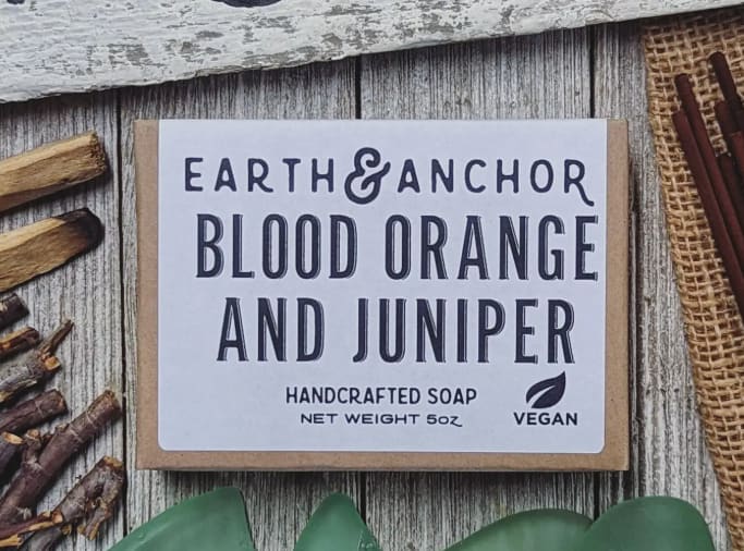 Blood Orange &amp; Juniper Handcrafted Vegan Soap - Earth &amp; Anchor Soap Co. - Blood Orange &amp; Juniper soap is a blend of dark, juicy blood orange with the warm, earthy scent of desert juniper. With a proprietary blend of Olive, Coconut &amp; Castor oils, we have created the perfect clean. For body, hands, or hair, we have created a blend that is all purpose and bubbly, moisturizing, and leaves you feeling fresh. Our soaps are always vegan, cruelty-free, and all-natural.  Ingredients: Saponified Oils of Olive, Coconut &amp; Castor, and Fragrance.  Handcrafted. Cruelty Free. Palm Free. Vegan. E&amp;A soaps are meticulously handcrafted with original formulations &amp; high quality ingredients using the traditional cold-process method. Every soap bar is made, cut, and packaged by hand (specifically...two sets of hands). Soaps are packaged in a plastic-free &amp; recyclable box with ingredient information. E&amp;A Handcrafted Vegan Soap is a great everyday purchase for folks shopping for themselves &amp; family  
